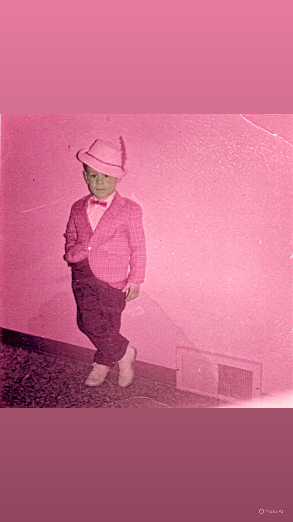 Vintage pink-tinted childhood photo of Greg Wiggs in a suit and hat