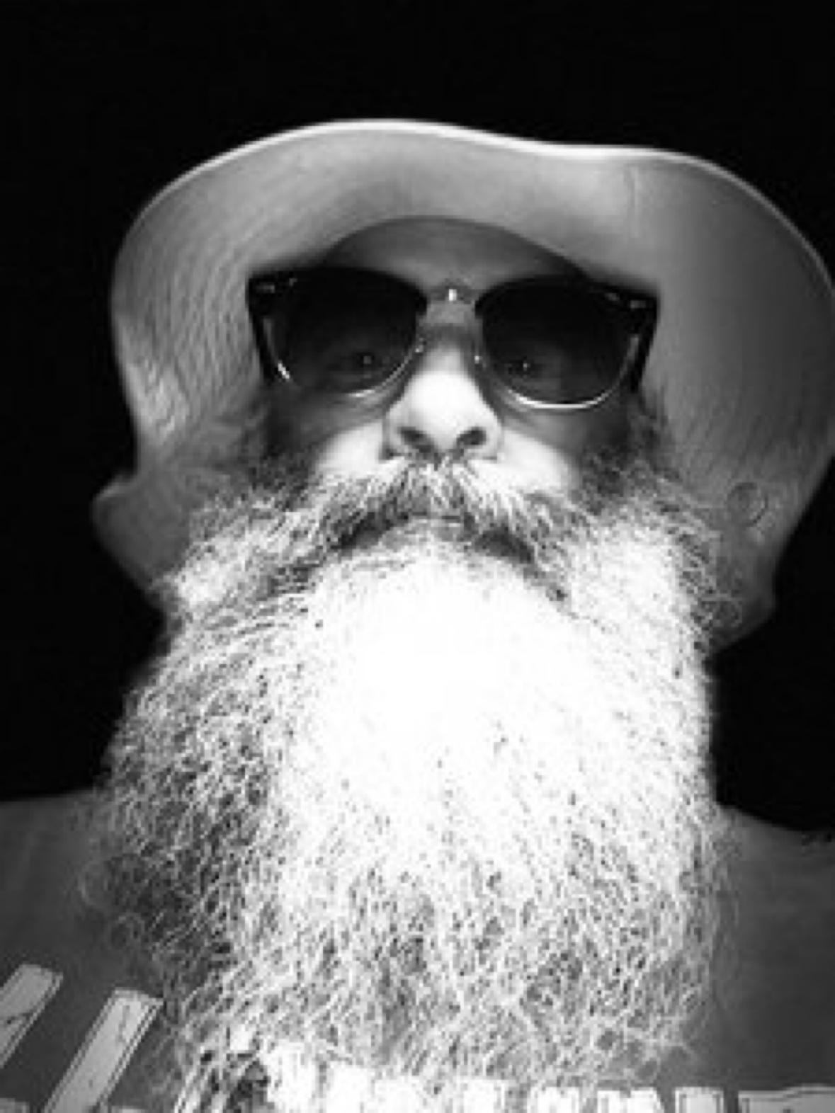 Greg Wiggs wearing sunglasses and a hat
